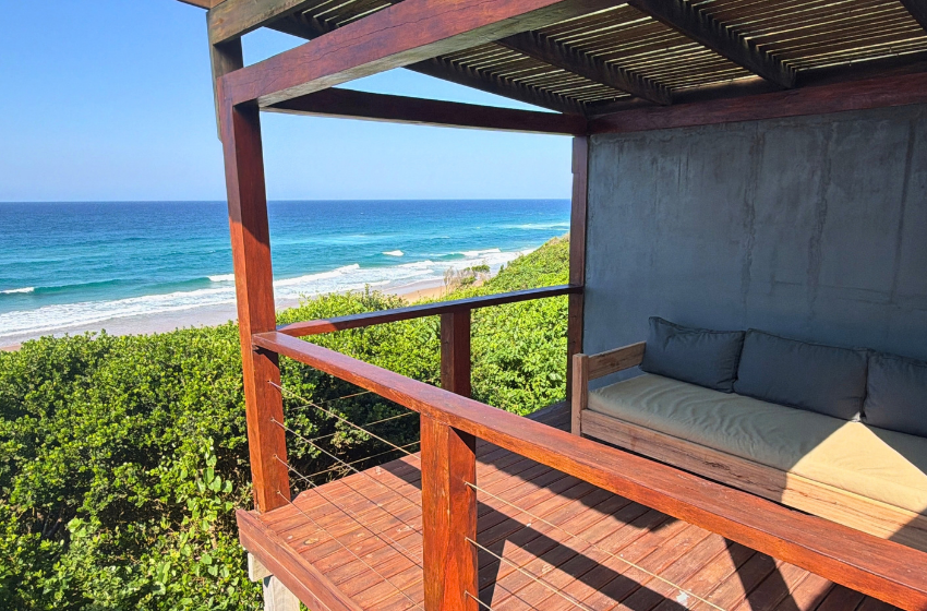 seating area on deck with sea view at Aloha 17 in Ponta Mamoli