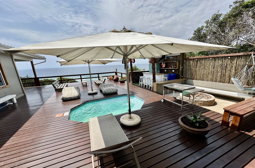 deck with pool and bar at Wakene 5 in Ponta Malongane