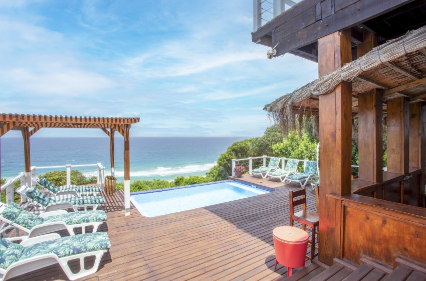 deck with pool and bar at Naudicals dune in Ponta Malongane