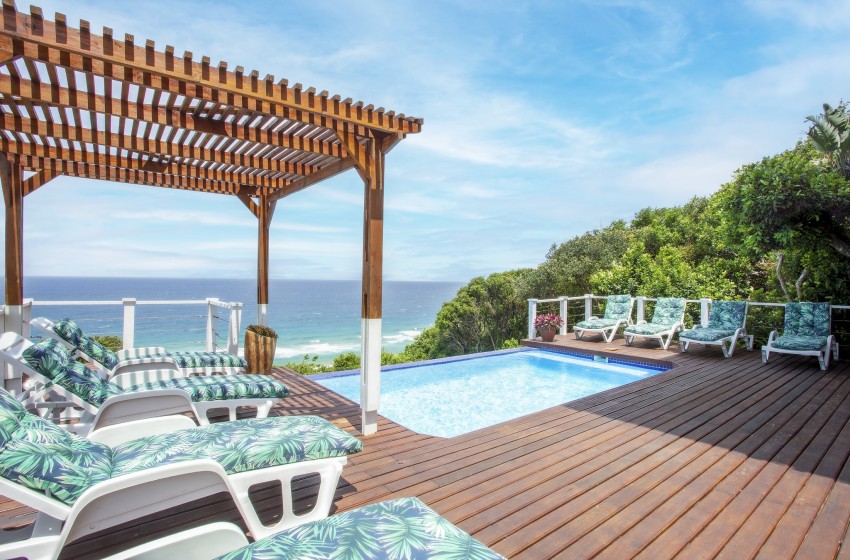 deck with pool and sea view at Naudicals dune in Ponta Malongane