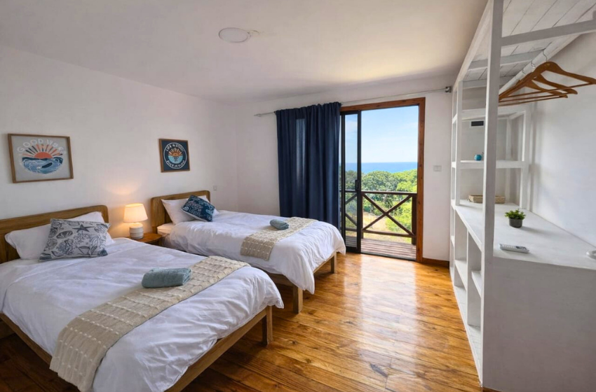 bedroom 2 with single beds at Salt and Sun in Ponta Malongane