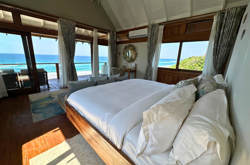 bedroom 1 with sea view at Aloha 5 in Ponta Mamoli