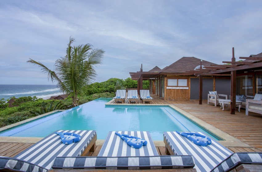 sun loungers overlooking pool at Aloha 7 in Ponta Mamoli